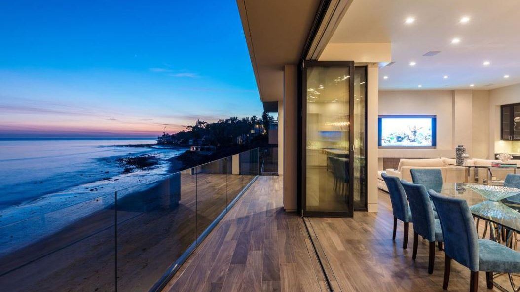 Latigo Shore home, patio overlooking the ocean in the evening - Inspiring Architectural Design - Dean Larkin Design