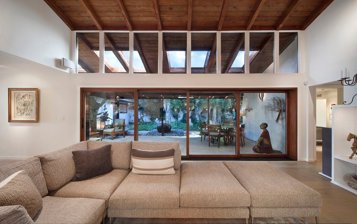 View across Cantoni couch into loggia and courtyard | River Lane Project | Dean Larkin Design