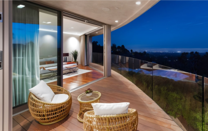 View of city lights from patio outside primary bedroom - Tigertail Project - Dean Larkin Design