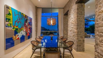 dining room with outdoor views and colored glass chandelier | Light in Contemporary Architecture | Dean Larkin Design