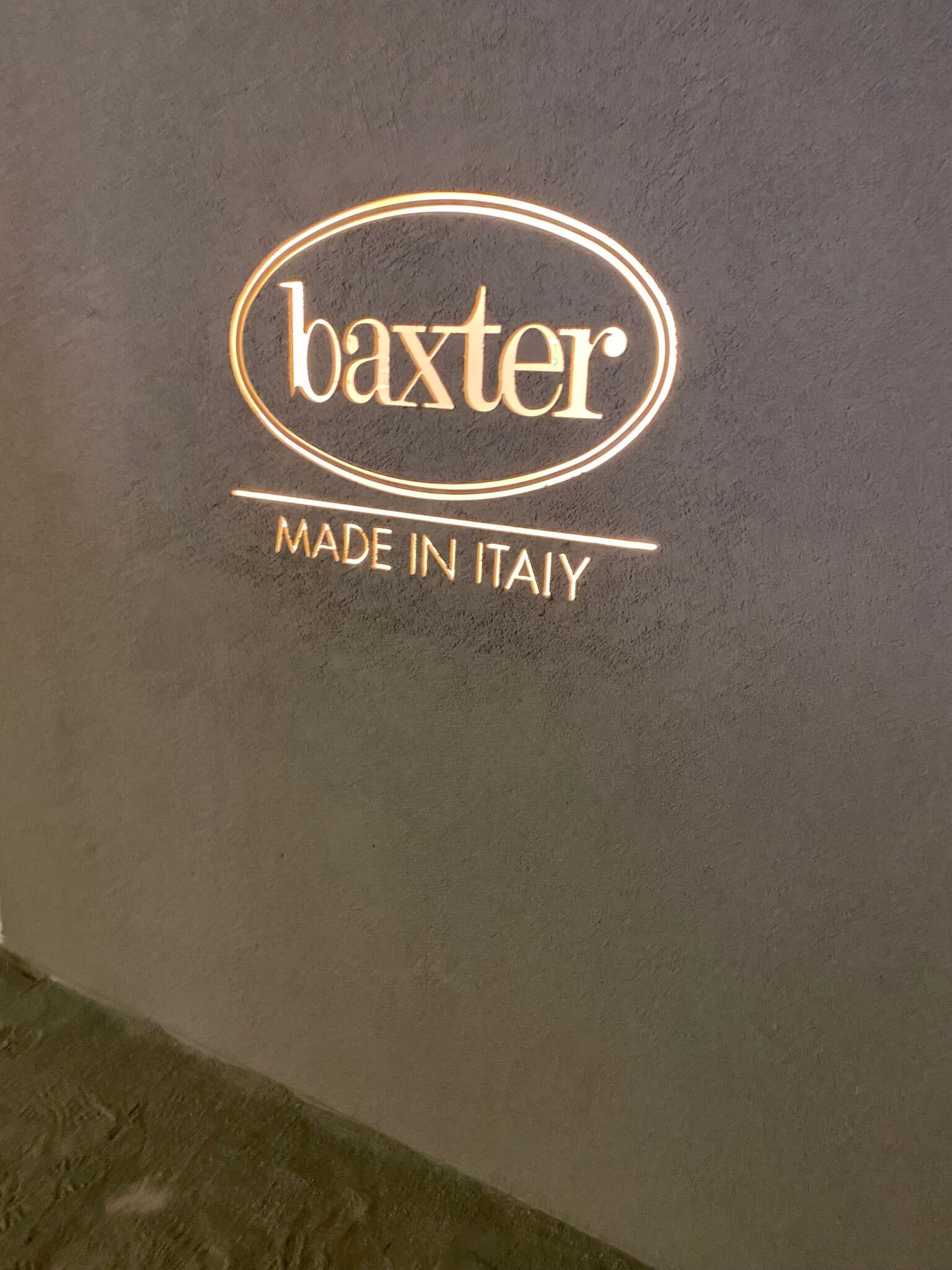 Brown wall with baxter logo - new trends at Salone del Mobile - Dean Larkin Design