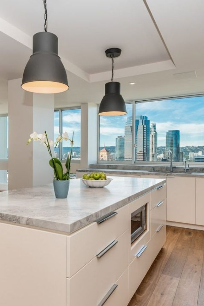 view of city from kitchen island with cream colored cabinets - dean larkin reviews