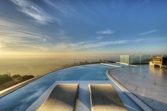 chaise lounges in a gorgeous pool in architecture design project Macapa Drive -Dean Larkin Design