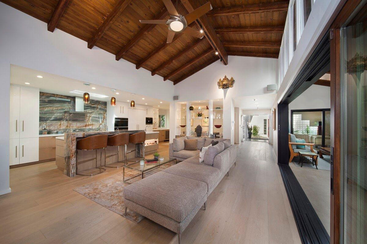 Wide view across Cantoni couch into kitchen | River Lane Project | Dean Larkin Design