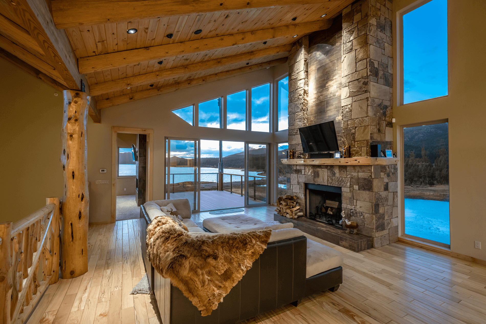 Eagle Lake Project - View of living room and deck with lake in background - Dean Larkin Design