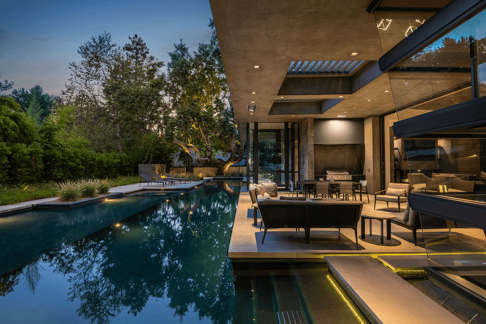 Latimer | Nighttime patio and pool | Dean Larkin Design