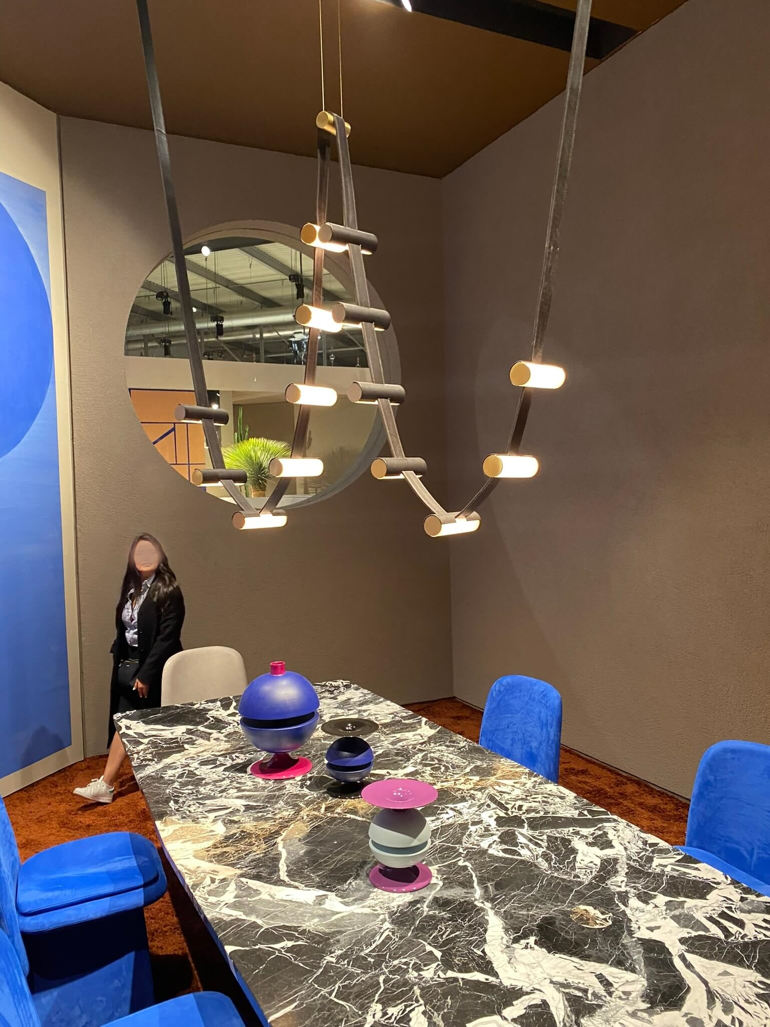 Baxter lighting fixture made with leather straps over marble table- new trends at Salone del Mobile - Dean Larkin Design