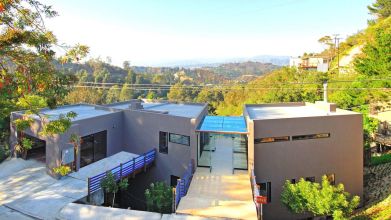 Home with covered breezeway between buildings | passive solar design | Dean Larkin Design