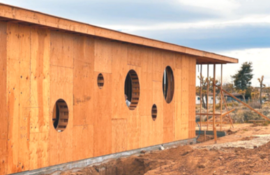 Actual image of one side of the house with the garage | Faith project spring solstice celebration Dean Larkin Design