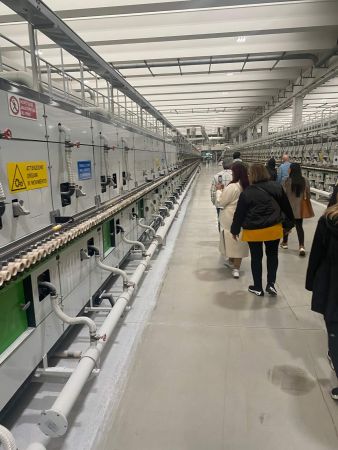 Group walking through FLorim factory beside gigantic kiln in Italy - Dean Larkin Design