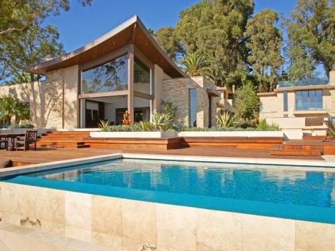 View across Cantoni couch into loggia and courtyard | River Lane Project | Dean Larkin Design