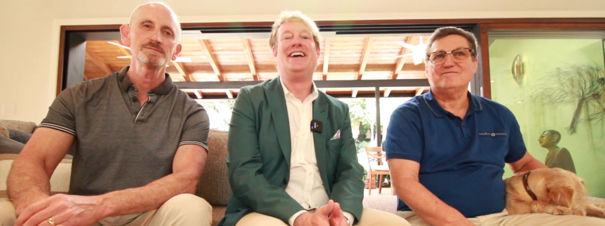 Scott Zucker, Ron, and Dean Larkin on couch at home at the River Lane architecture project - Dean Larkin Design